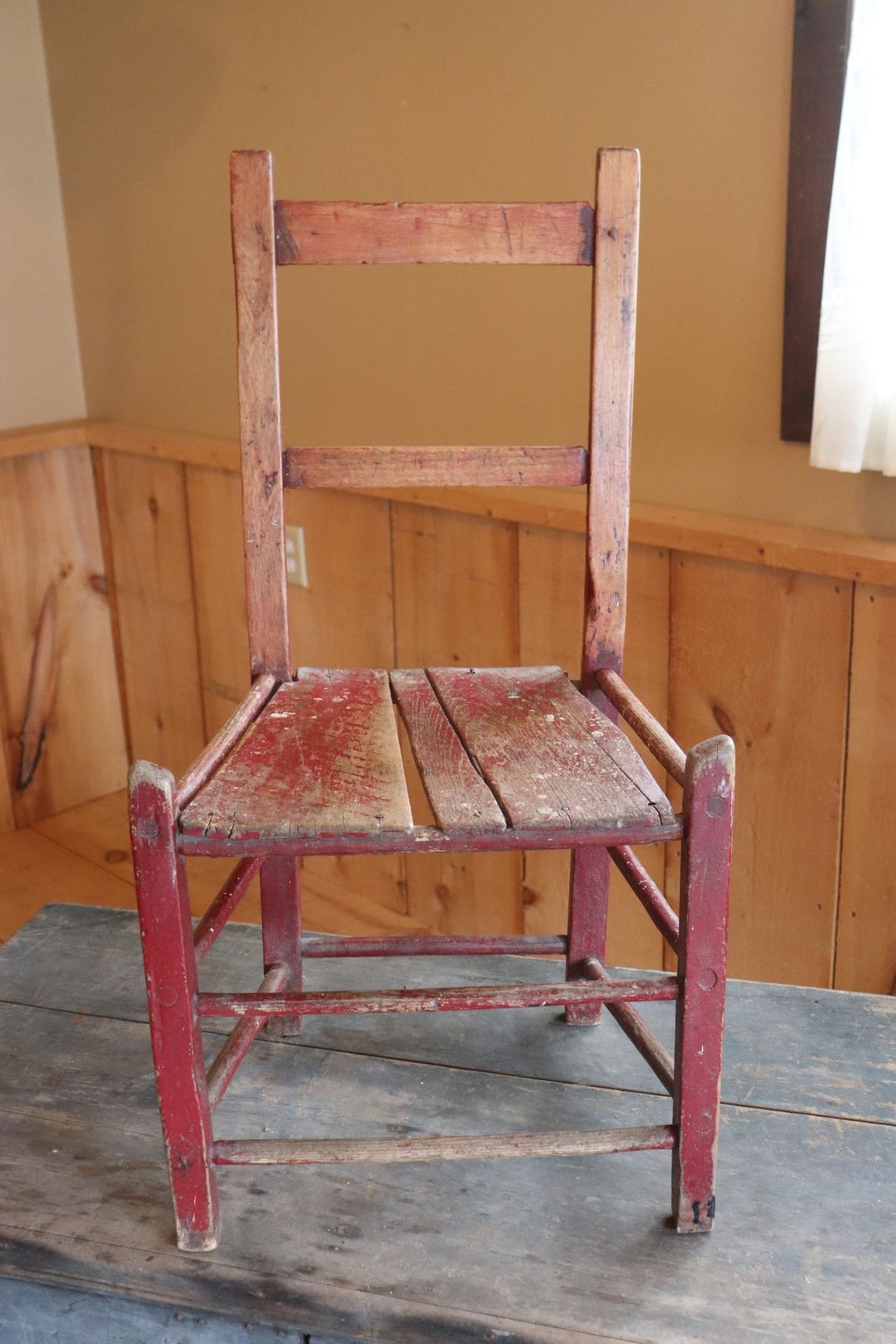 Old Primitive Wooden Chair With Remnants Of Red Paint