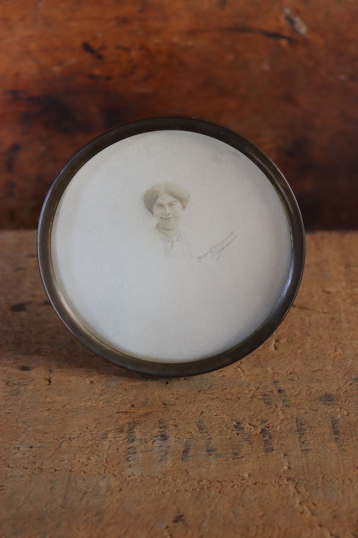 Old Photograph Of A Woman In A Round Frame